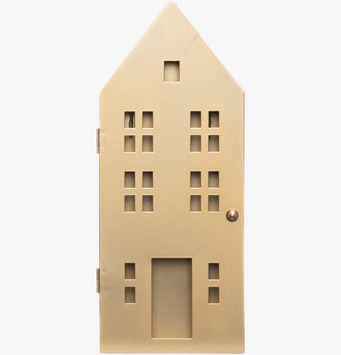 Bild av nyckelskåp i husform med guldfinish och fönsterdetaljer